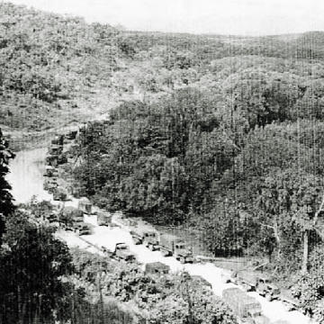 Vehicles transporting equipment to load onto ships at Portland Jetty